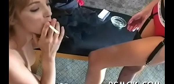  Mature slut blows a dude while smoking a cigarette